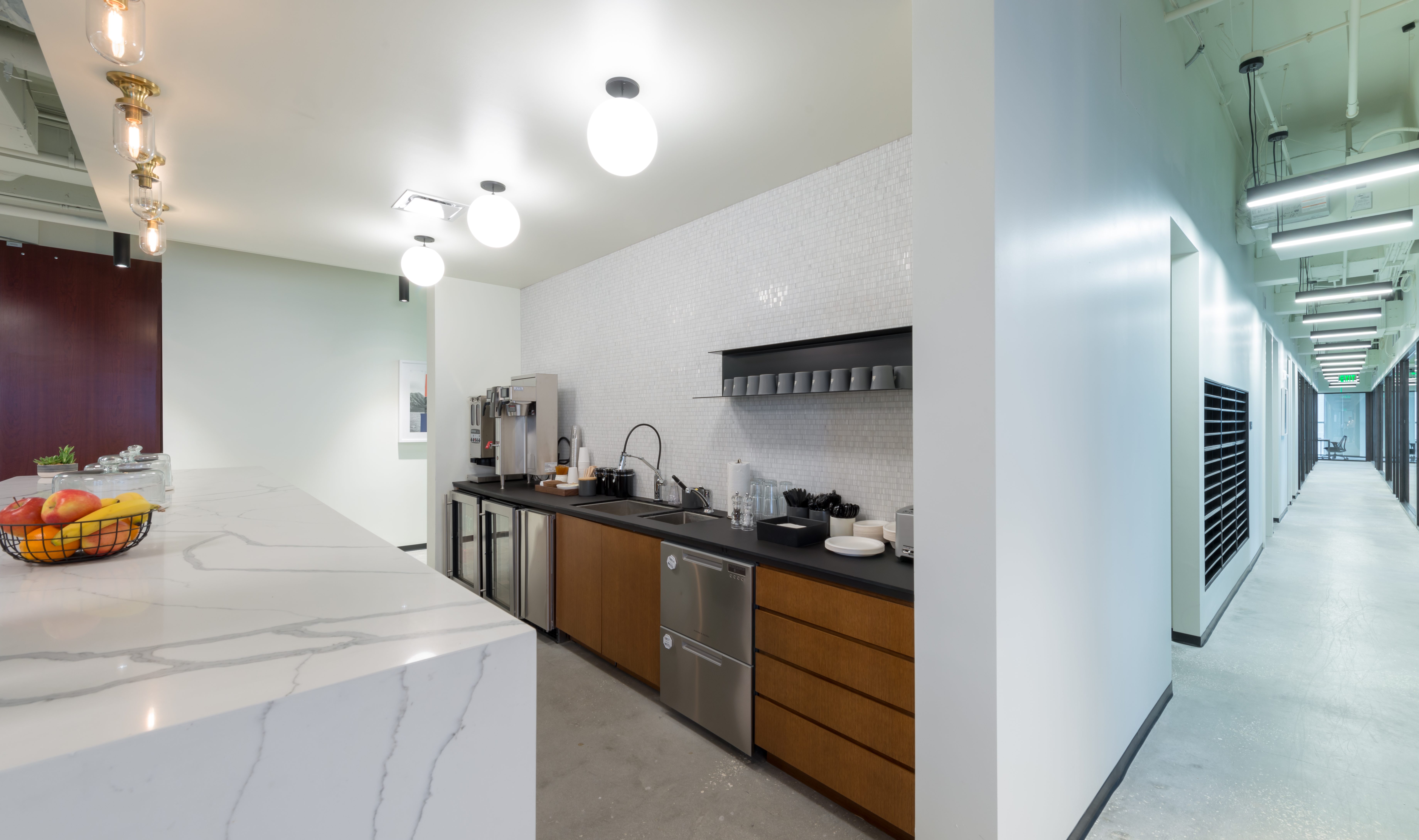 Industrious Kitchen Area Showing Tile Wall and Modern Design